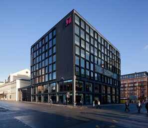 A modern building with a prominent logo at the top. - citizenM Glasgow (Glasgow)
