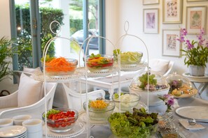 Enjoy a sumptuous spread of salads, vegetables, and appetizers at our buffet.