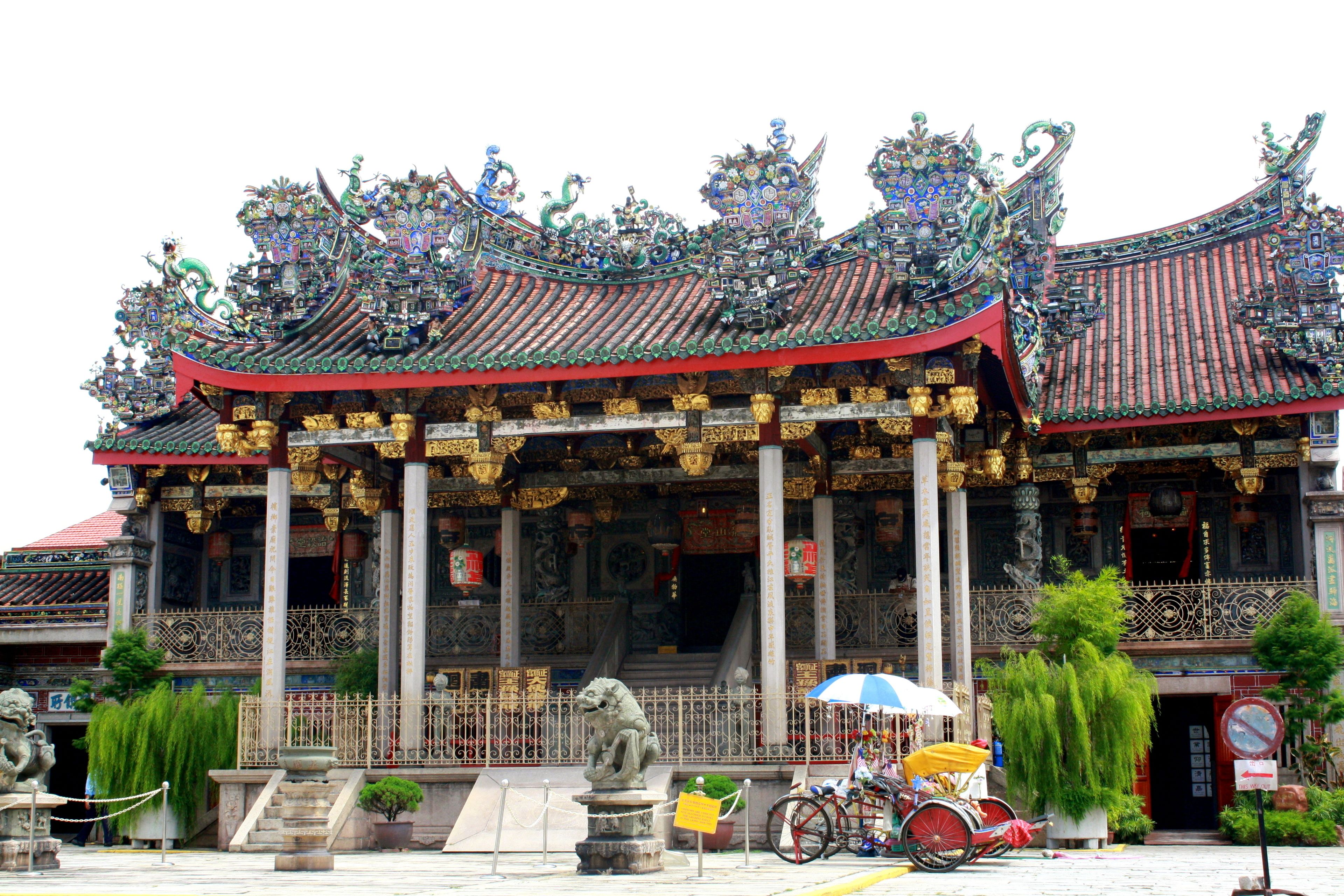 A traditional building with ornate architecture, including a multi-tiered roof and decorative elements.