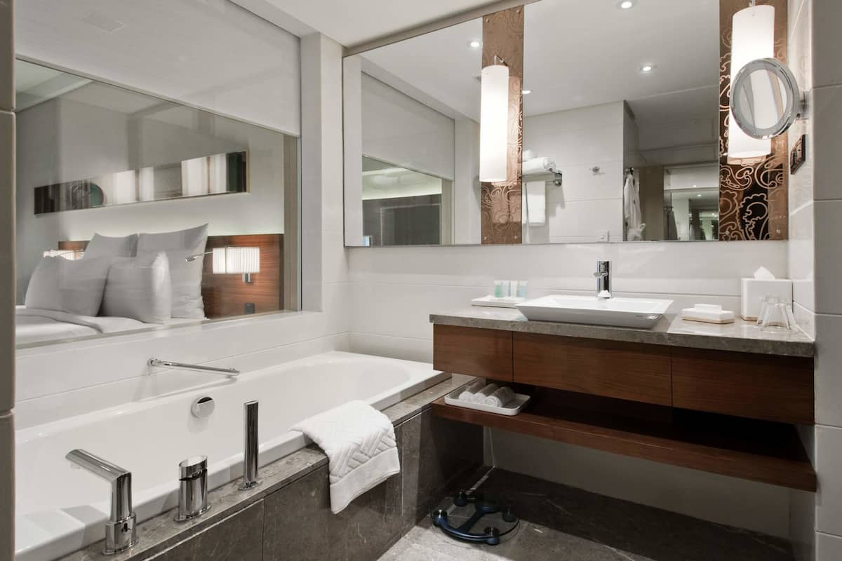 separate bathtub and shower, deep-soaking bathtub, rainfall showerhead