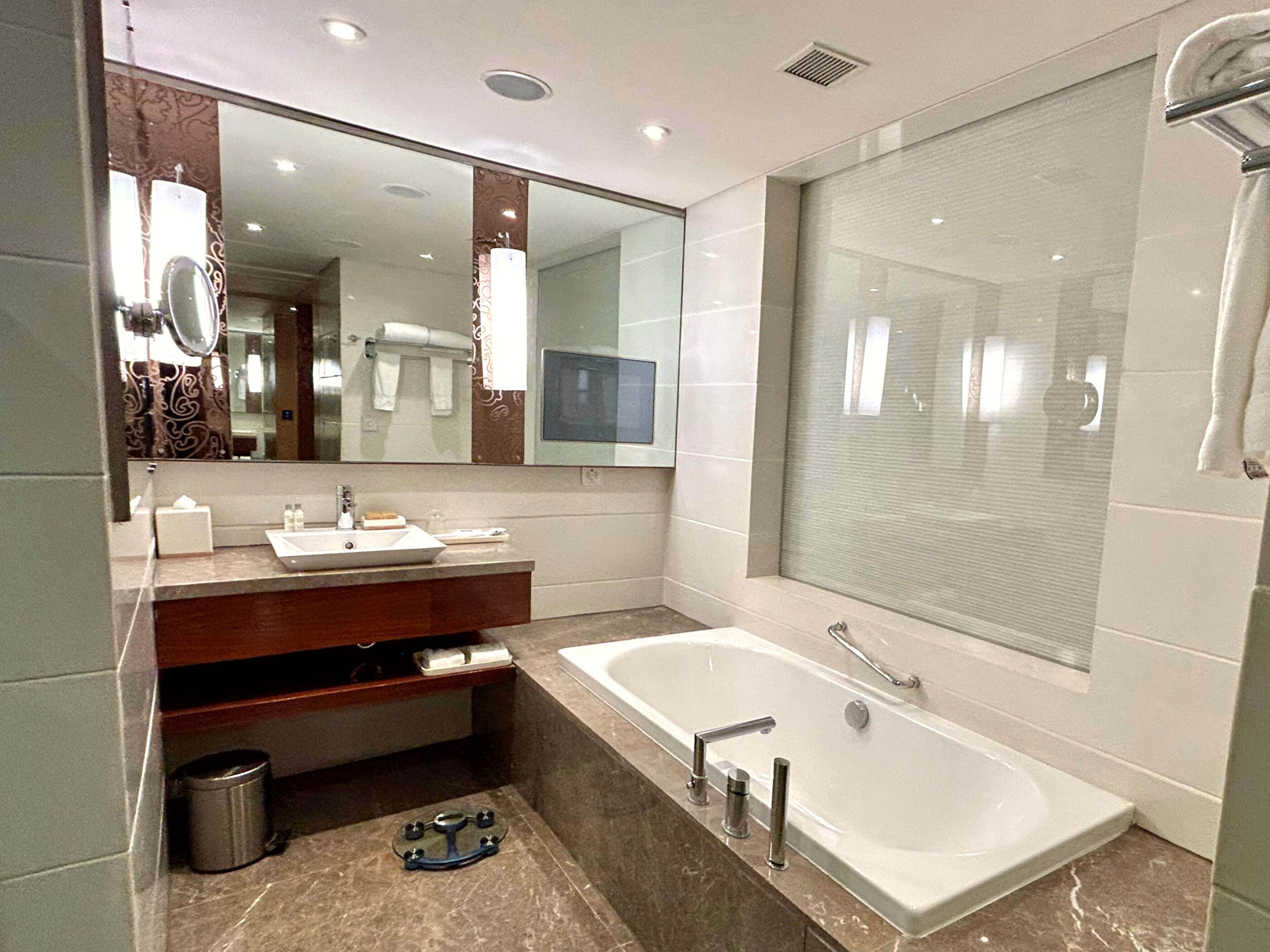 separate bathtub and shower, deep-soaking bathtub, rainfall showerhead