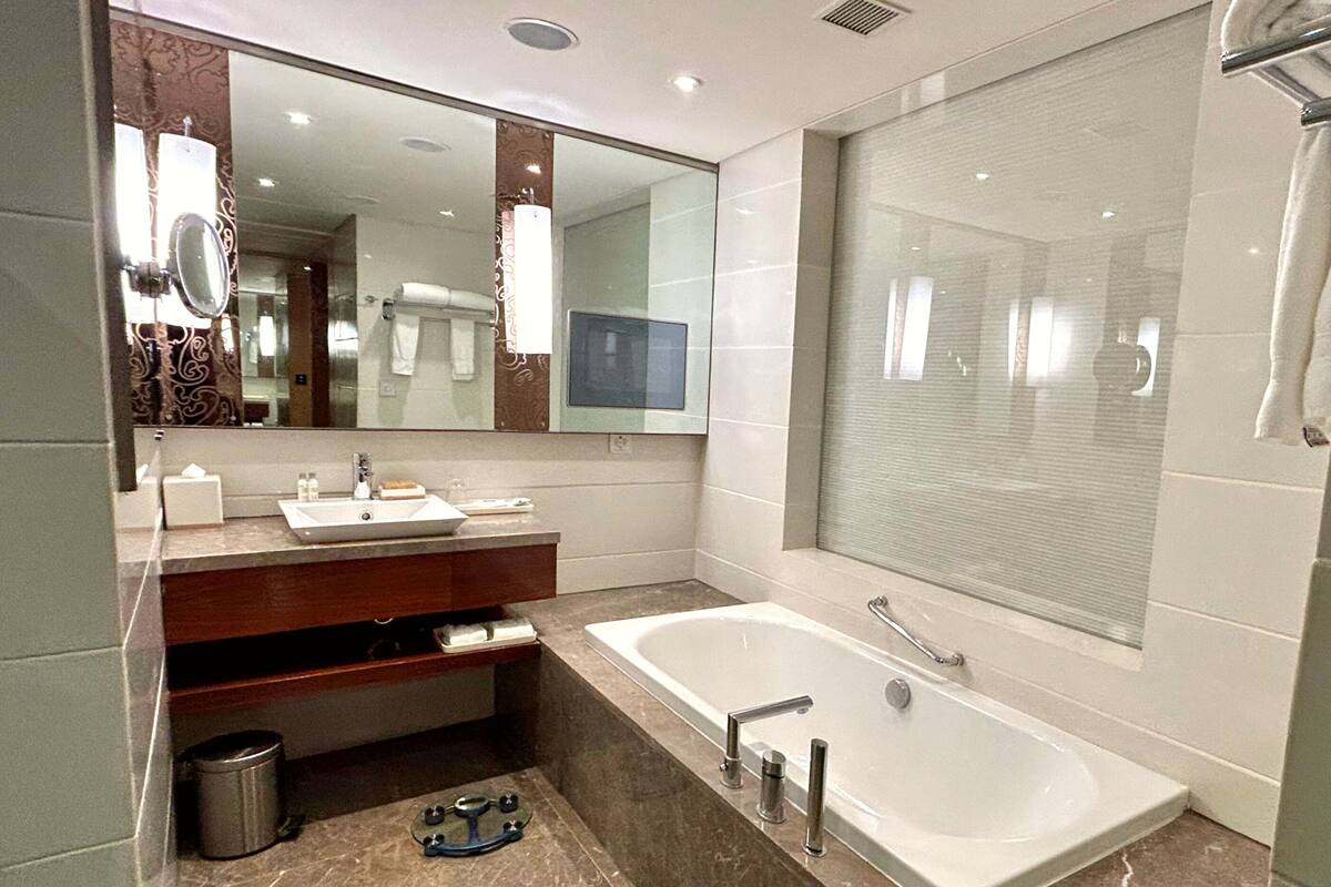 separate bathtub and shower, deep-soaking bathtub, rainfall showerhead