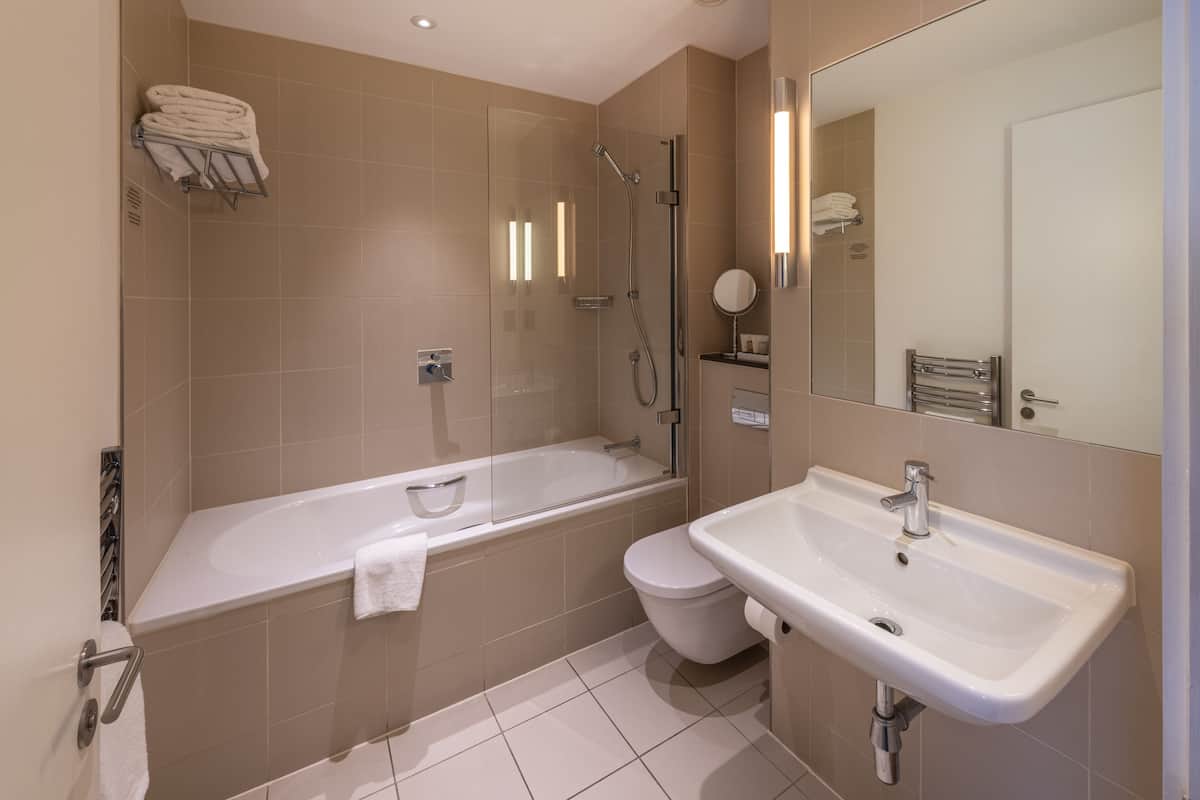 superior room | bathroom | designer toiletries, hair dryer, towels