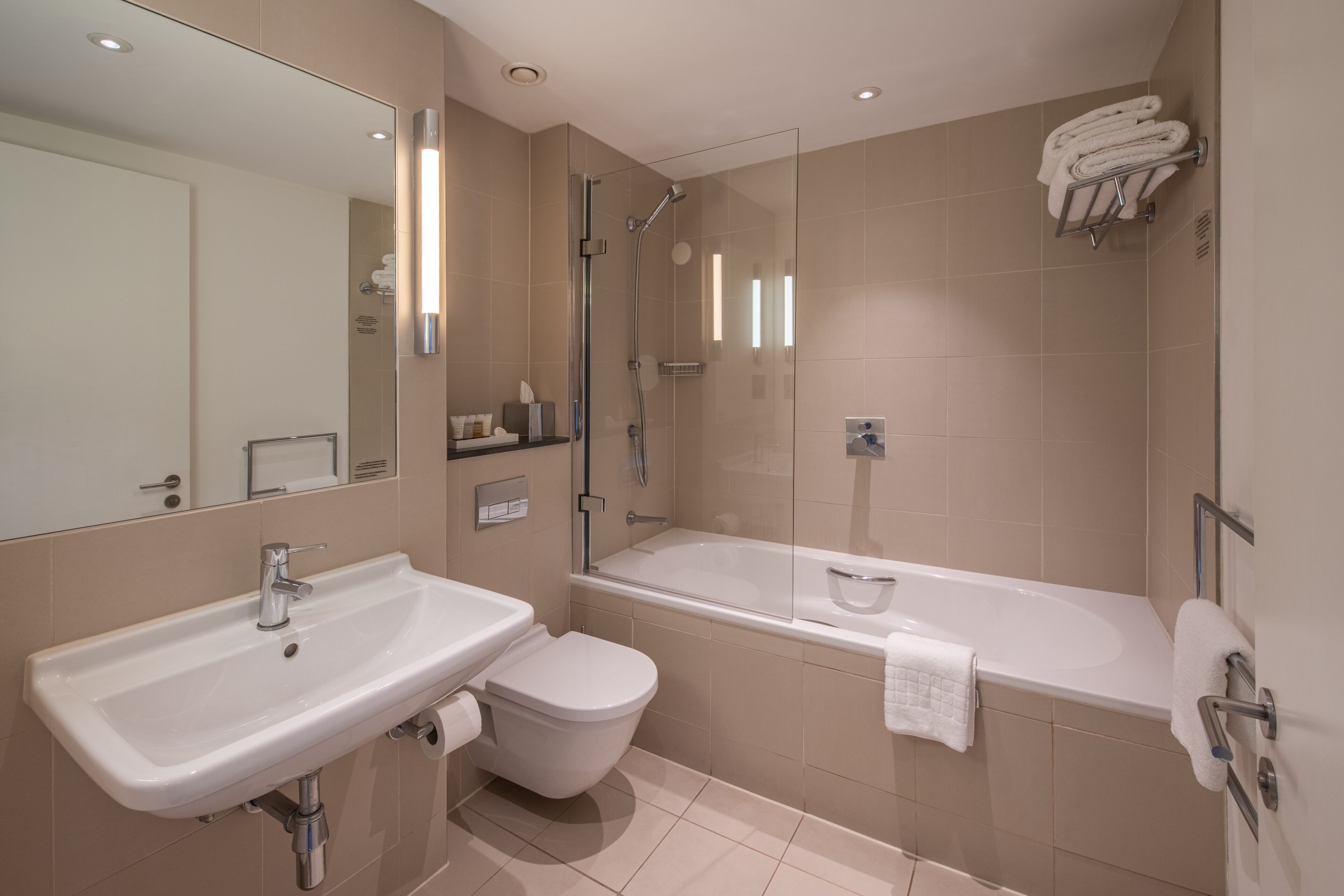 deluxe room, multiple beds | bathroom | designer toiletries, hair dryer, towels