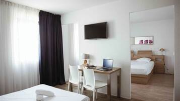 Family Studio, Kitchenette | Desk, soundproofing, iron/ironing board (on request), WiFi (free)