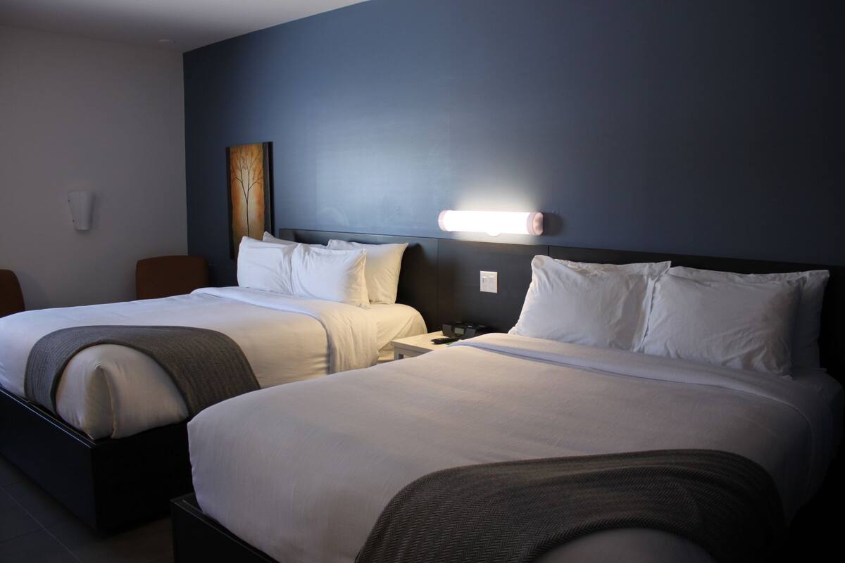 Standard Room, 2 Queen Beds | In-room safe, desk, iron/ironing board, free WiFi