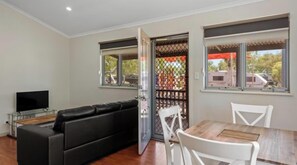 Deluxe 1 Bedroom Cabin | Living area | TV - Discovery Parks - Pilbara, Karratha (Baynton)