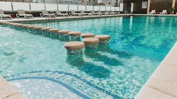 Seasonal outdoor pool, open 9:30 AM to 9:00 PM, pool umbrellas