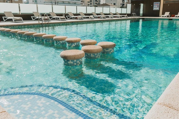 Seasonal outdoor pool, open 9:30 AM to 9:00 PM, pool umbrellas