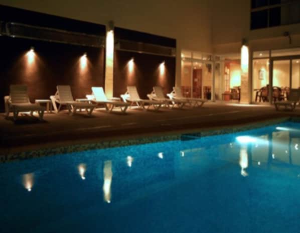 Seasonal outdoor pool, open 9:30 AM to 9:00 PM, pool umbrellas