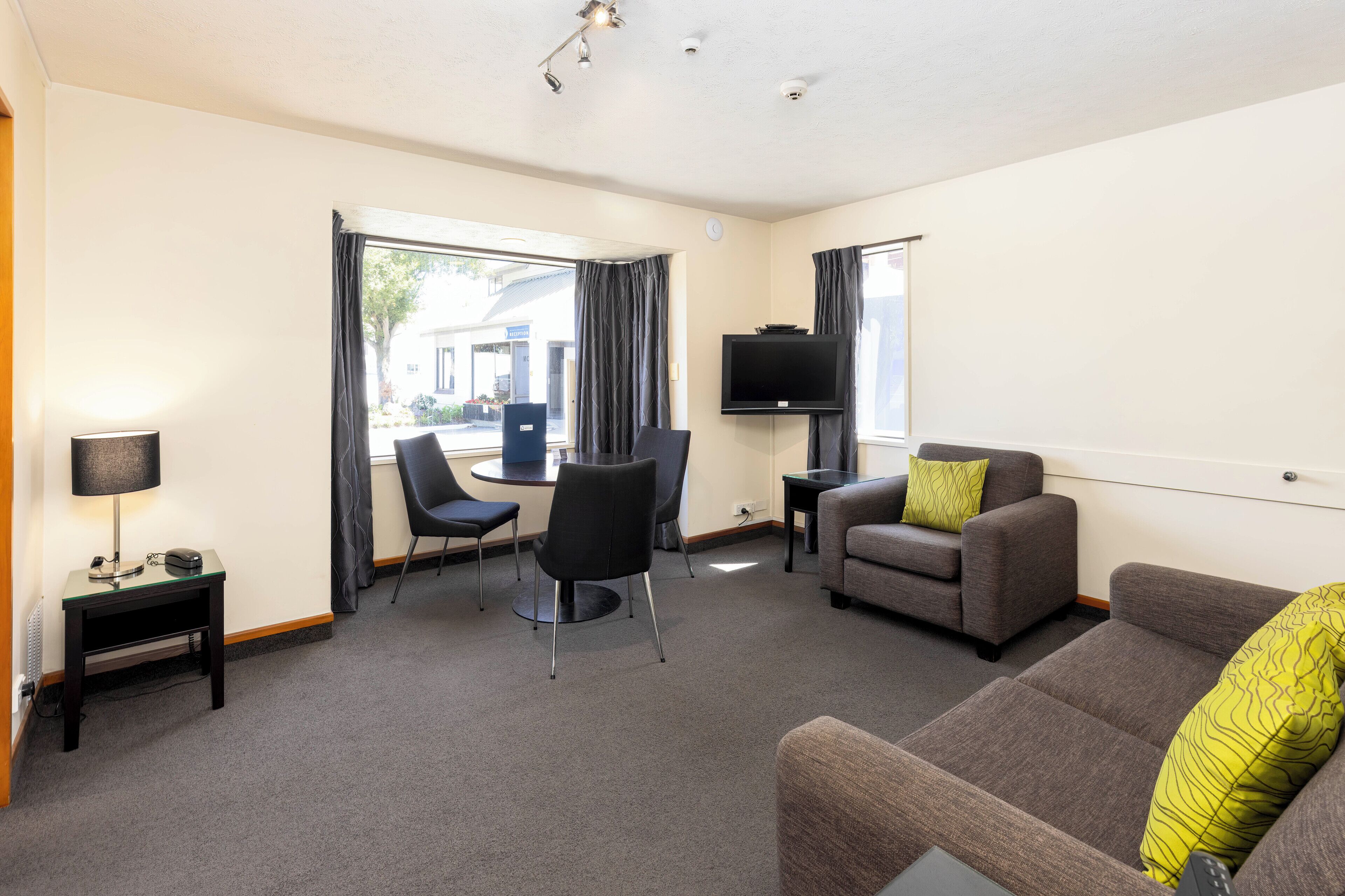 economy 1 bedroom | living area | 65-inch flat-screen tv with digital channels, tv, netflix