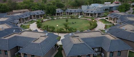 A residential area with multiple houses featuring sloped roofs and brick exteriors.