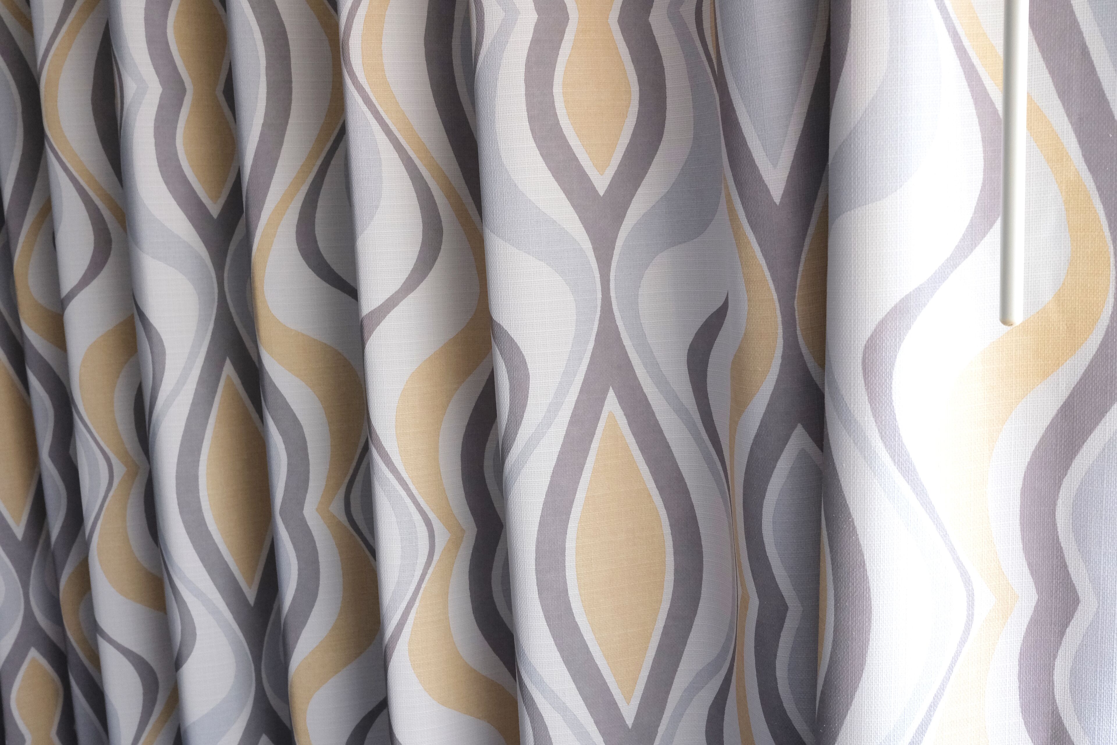 A close-up of a curtain with a geometric pattern.