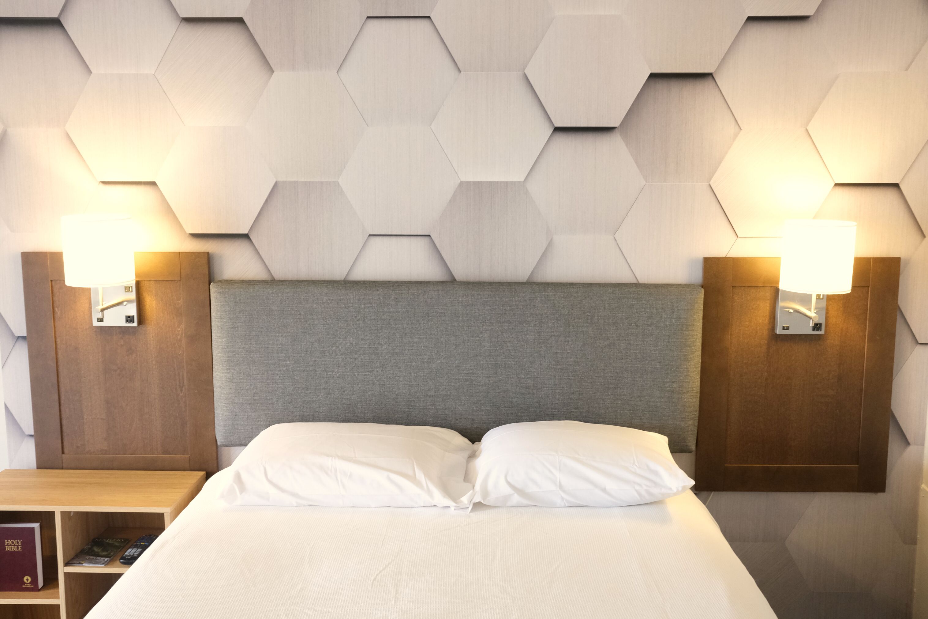 Premium bedding, desk, laptop workspace, blackout drapes