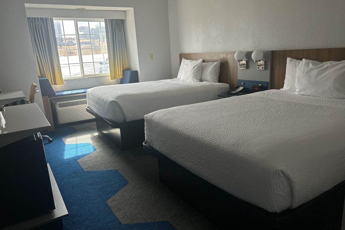 desk, blackout curtains, iron/ironing board, free cots/infant beds