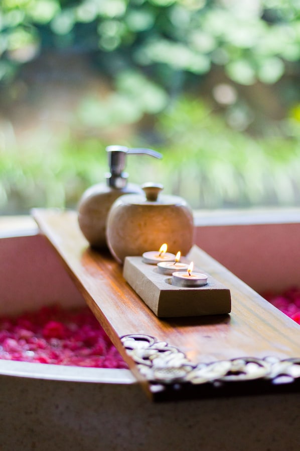 A wooden shelf with a soap dispenser and candles. - Ashoka Tree Resort at Tanggayuda, Ubud (Ubud)