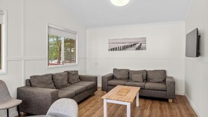 Superior 2 Bedroom Cabin - Sleeps 6 | Living area | TV, DVD player - Discovery Parks - Woodman Point (Coogee)