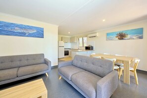  2 Bedrooms Pool View Cabin | Living area | Flat-screen TV - RAC Exmouth Cape Holiday Park (Exmouth)