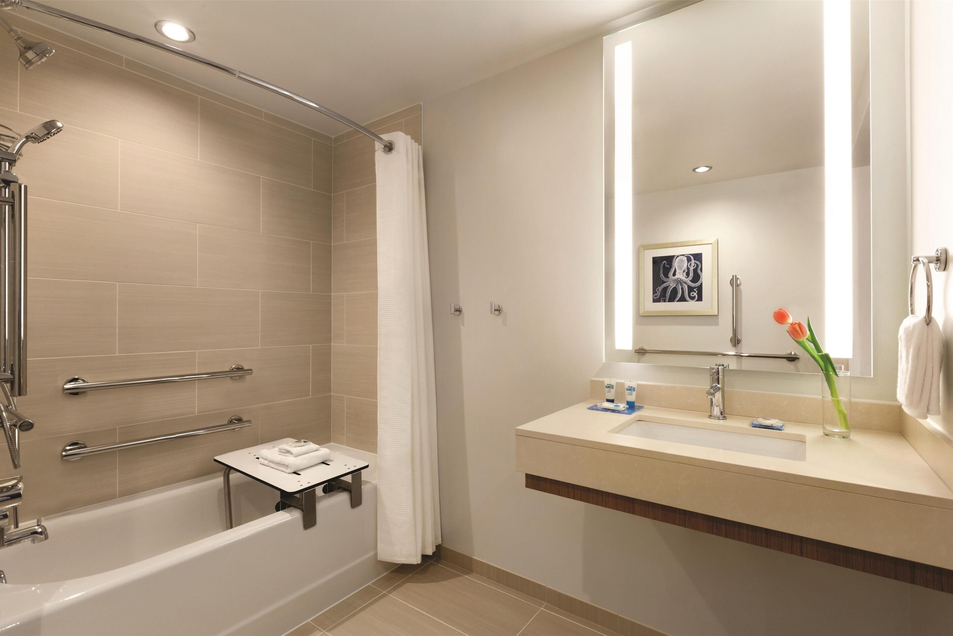 designer toiletries, hair dryer, towels