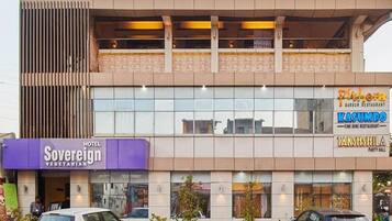 A hotel with a modern facade, including a vegetarian restaurant and a fine dining restaurant.