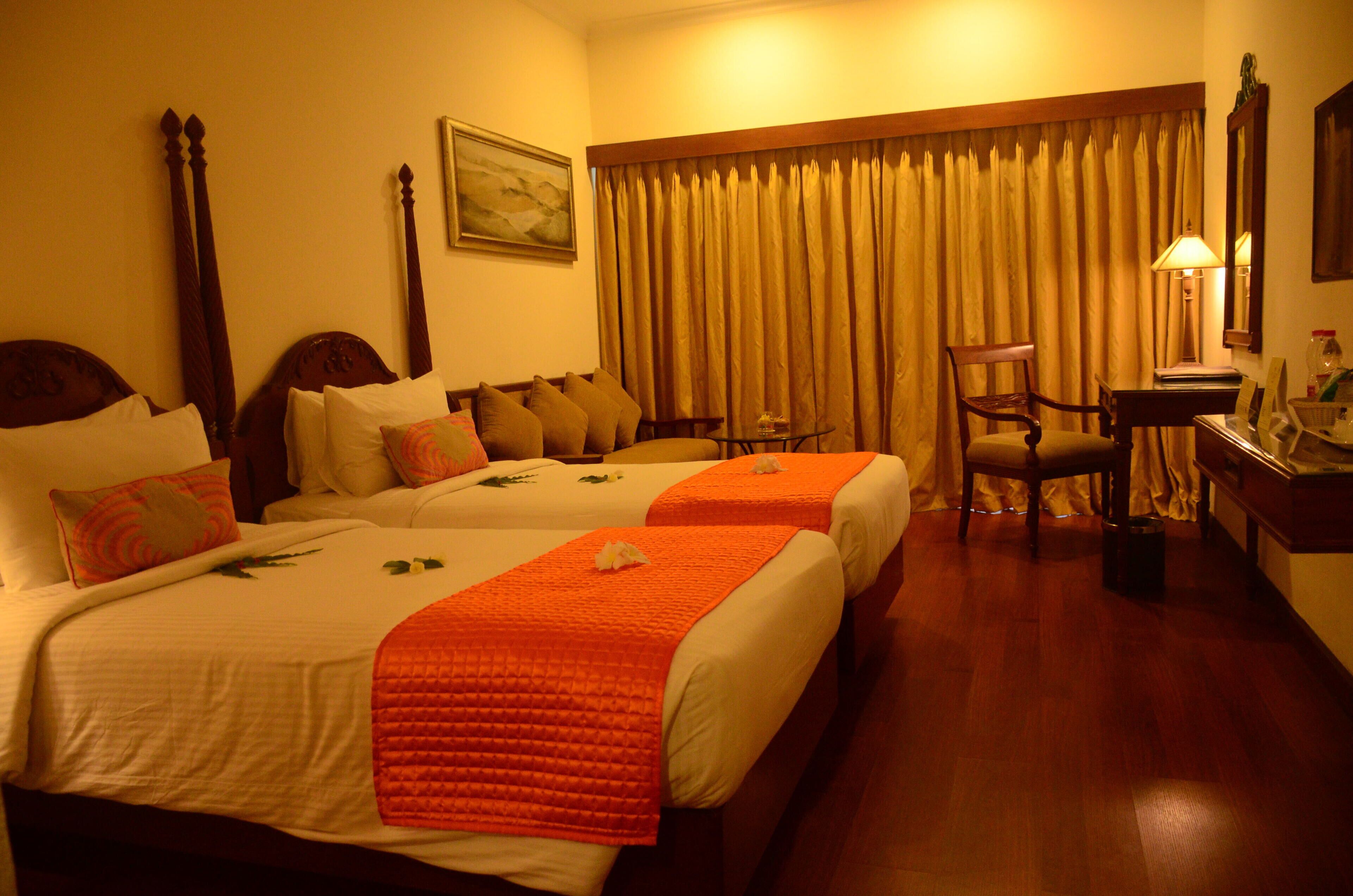 deluxe room with pool & garden view on ground floor | in-room safe, desk