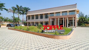 A resort with a large sign reading "70PPLE RESORT". - 7 Apple Resort Lonavala (Mawal)