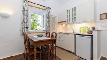 Apartment, 2 Bedrooms (for 4 people) | Private kitchenette | Fridge, microwave, stovetop, coffee/tea maker