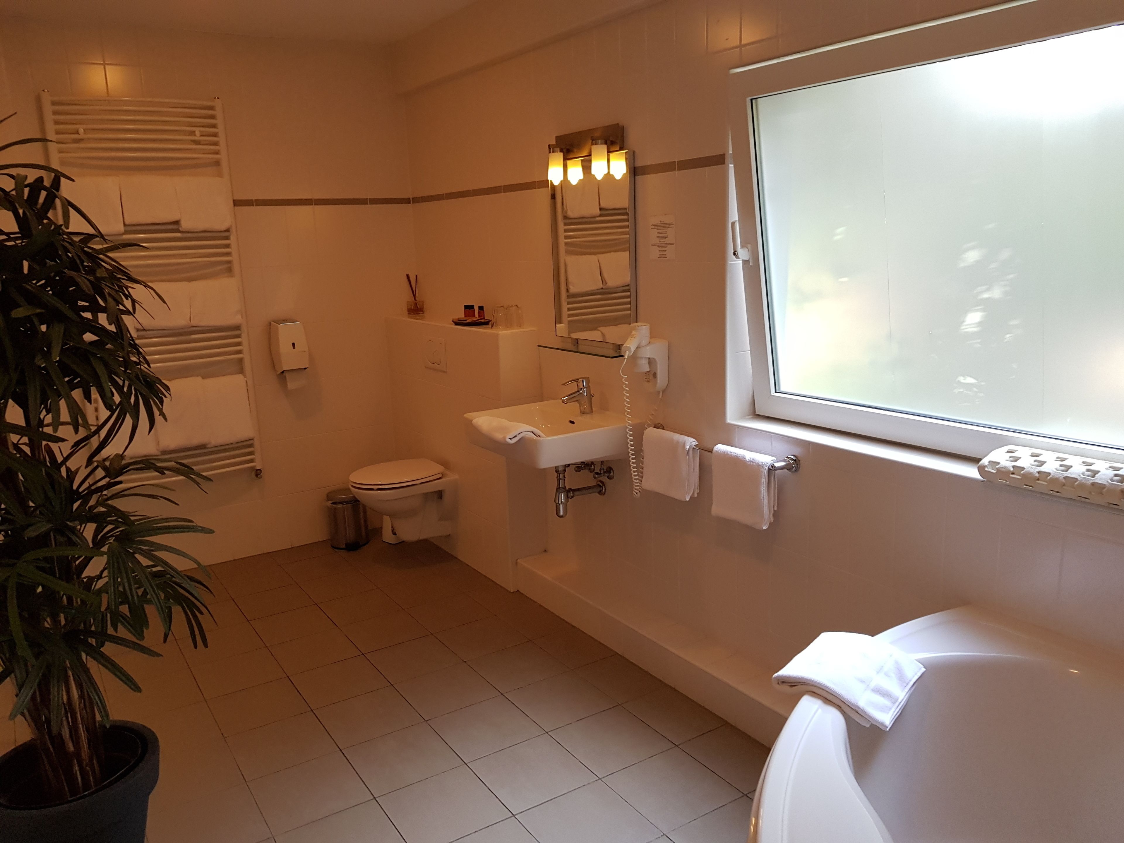 family room, annex building | bathroom | bathtub, hair dryer, towels