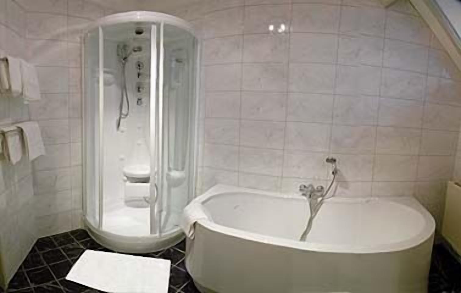 family room | bathroom | bathtub, hair dryer, towels