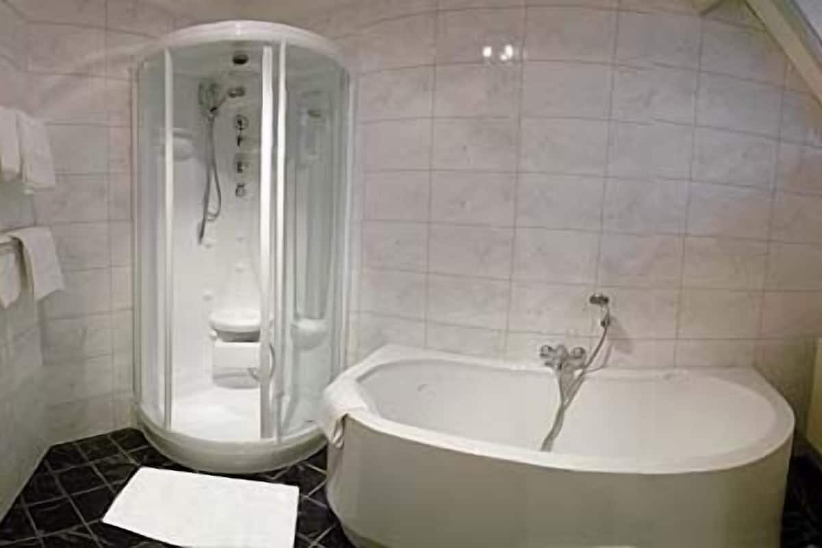 family room | bathroom | bathtub, hair dryer, towels