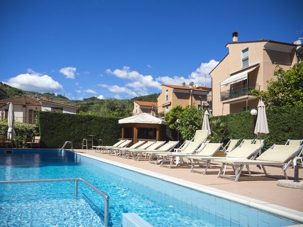 Outdoor pool, pool umbrellas, pool loungers