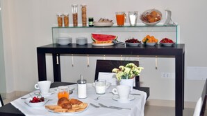 A breakfast buffet with various food items and beverages. - La Punta (Otranto)