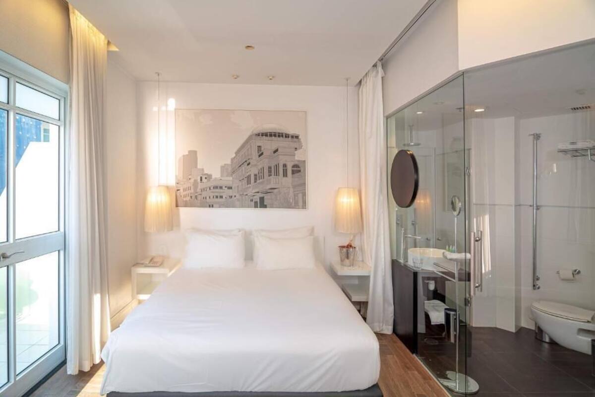 Deluxe Double Room with Front View and Side Balcony | In-room safe, desk, laptop workspace, blackout drapes