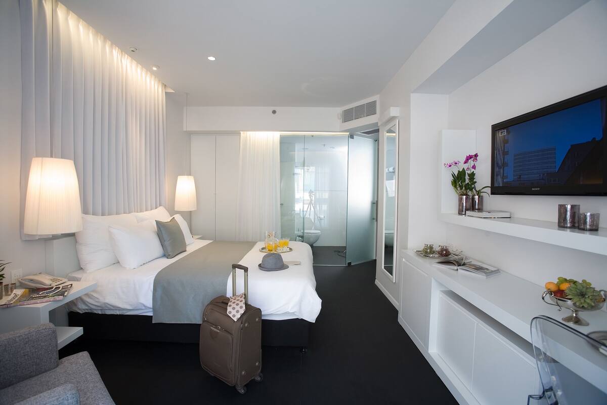 Deluxe Room, Side Sea View | In-room safe, desk, laptop workspace, blackout drapes