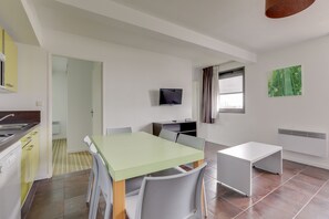 APARTMENT (DOUBLE BED, SINGLE BEDS AND SOFA BED) | Living area | Flat-screen TV - All Suites Appart Hôtel | Bordeaux Lac (Bordeaux)