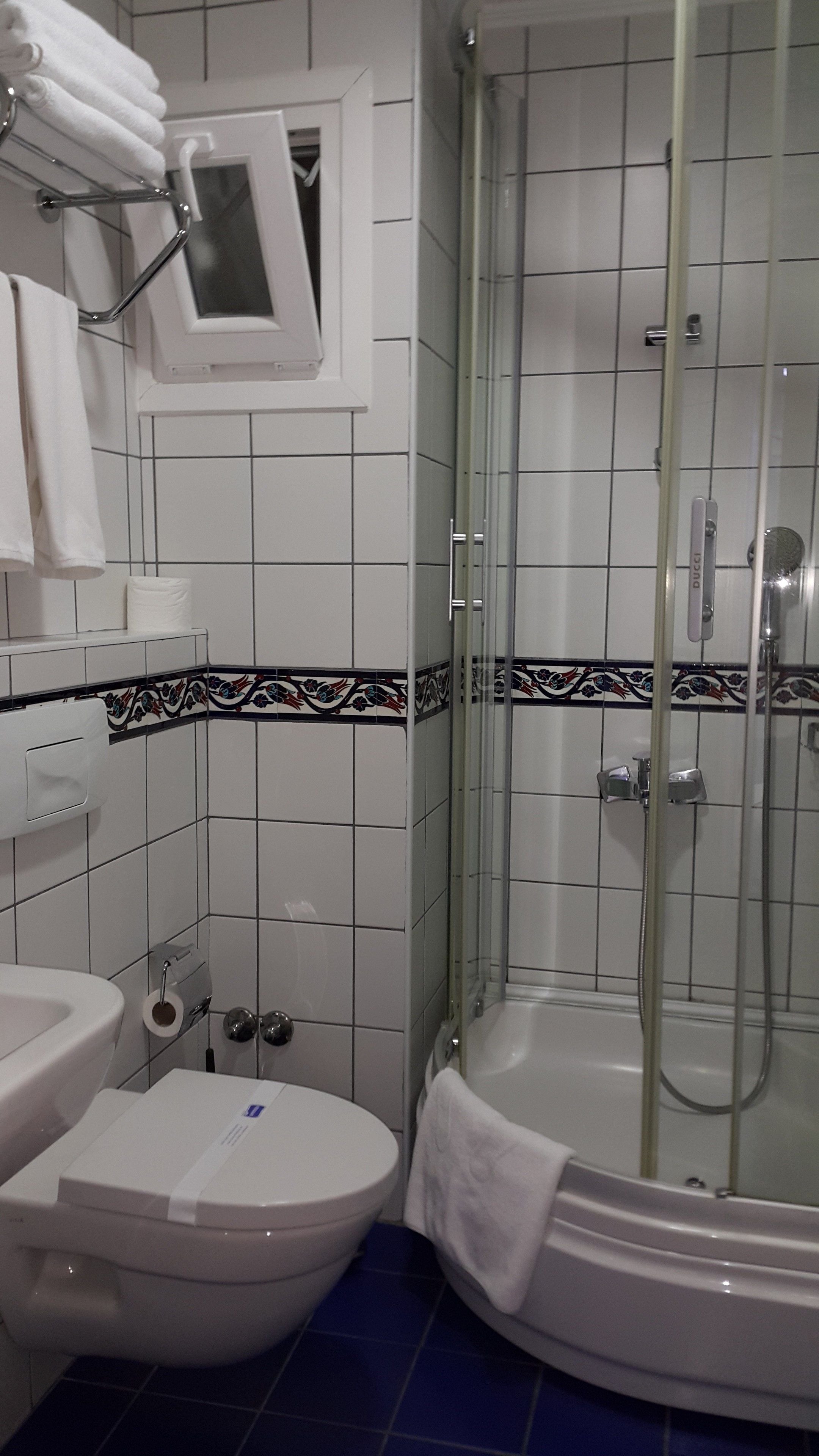 triple room | bathroom | shower, hair dryer, slippers, towels
