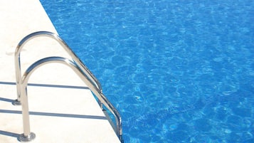 Seasonal outdoor pool, pool umbrellas, sun loungers