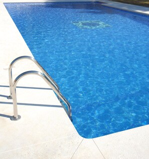 Seasonal outdoor pool, pool umbrellas, pool loungers