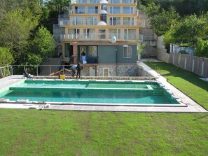 Seasonal outdoor pool, pool umbrellas, pool loungers