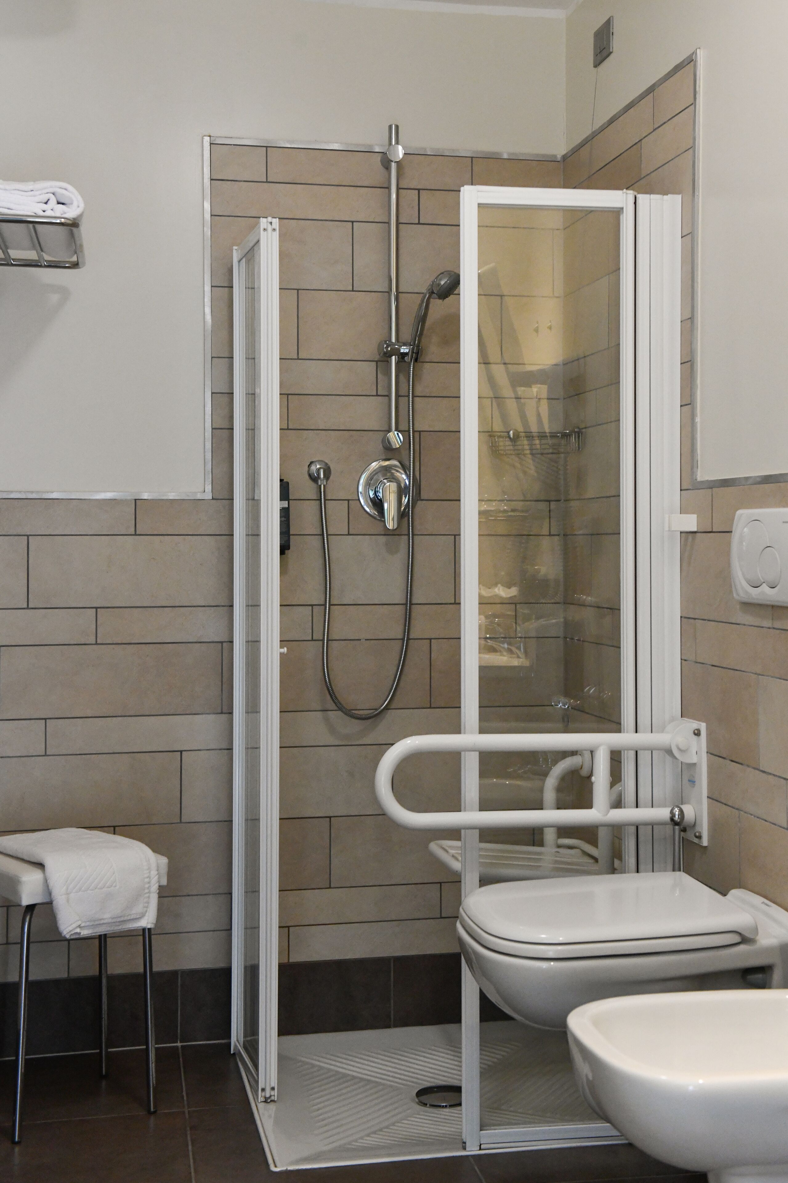 shower, hair dryer, bidet, towels