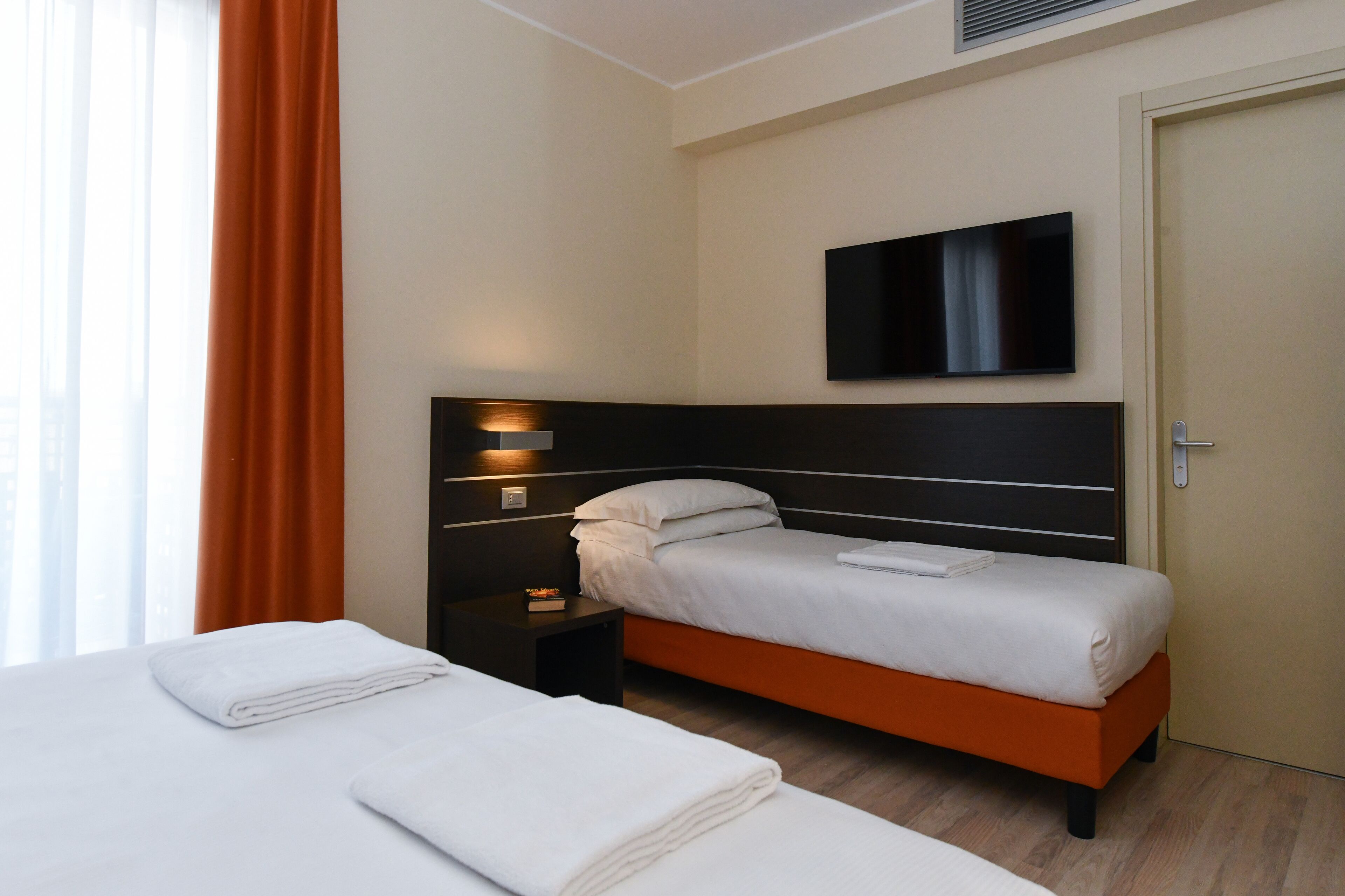 triple room, balcony | minibar, in-room safe, desk, blackout curtains