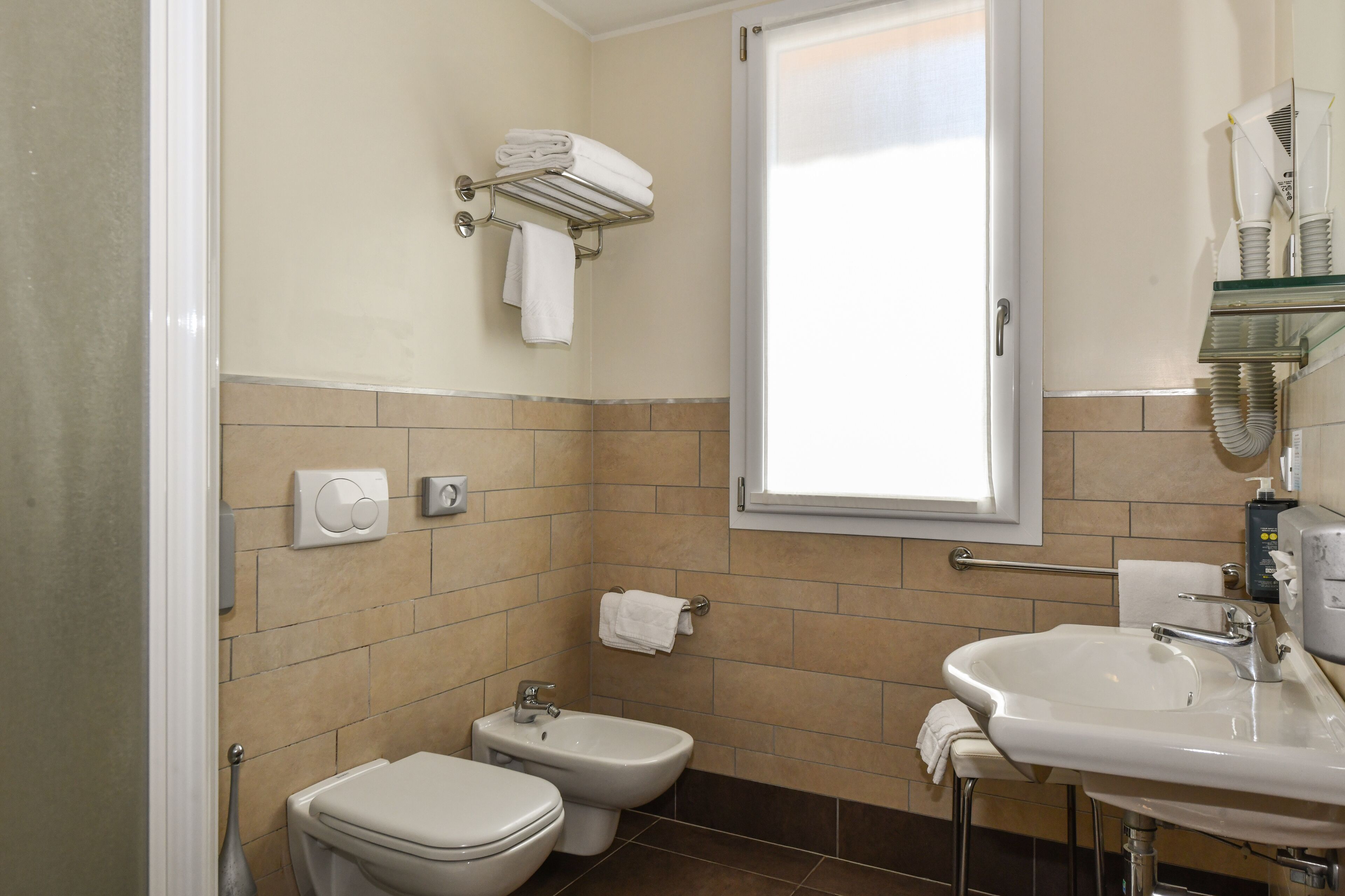 shower, hair dryer, bidet, towels