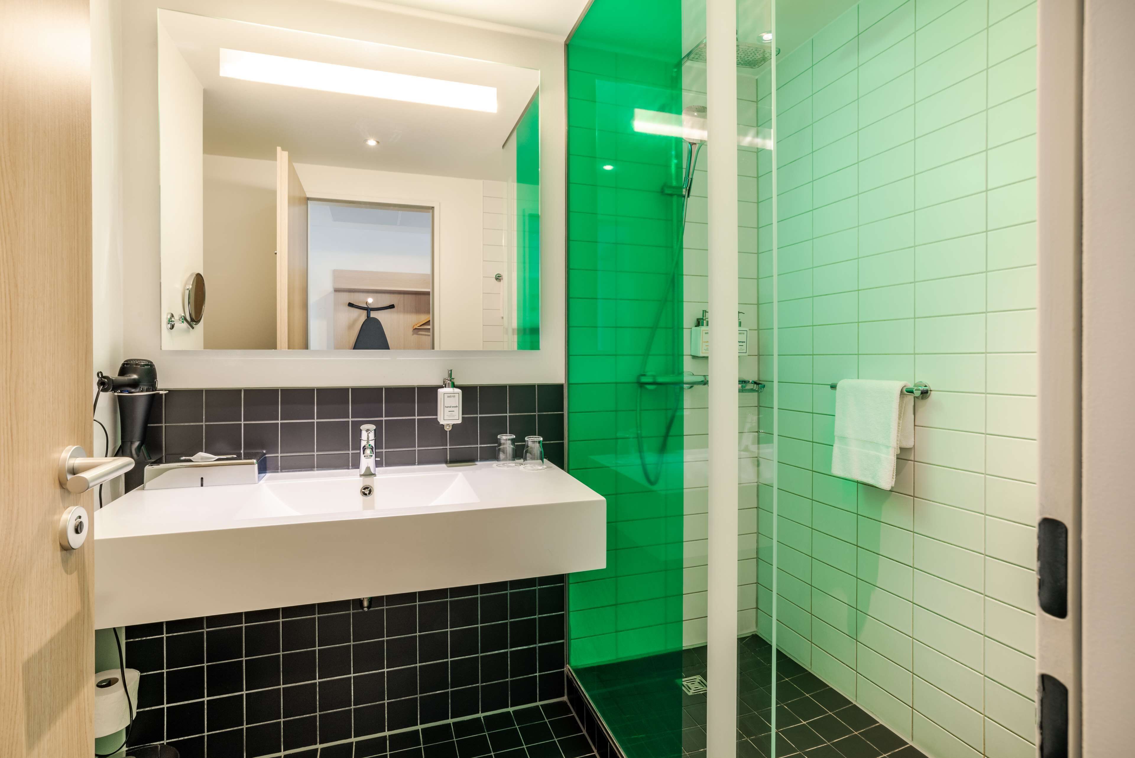 superior room (high floor) | bathroom | shower, eco-friendly toiletries, hair dryer, towels