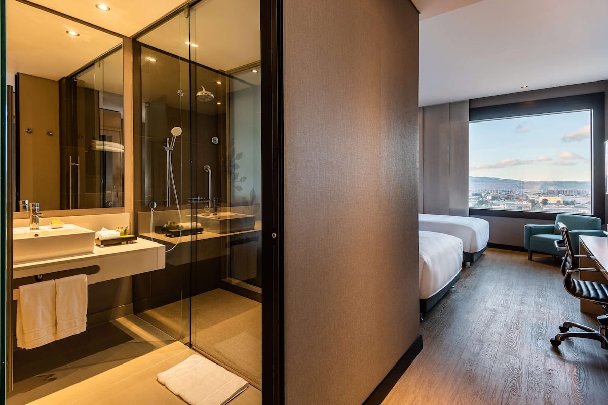 Room, 2 Double Beds | In-room safe, desk, laptop workspace, blackout drapes