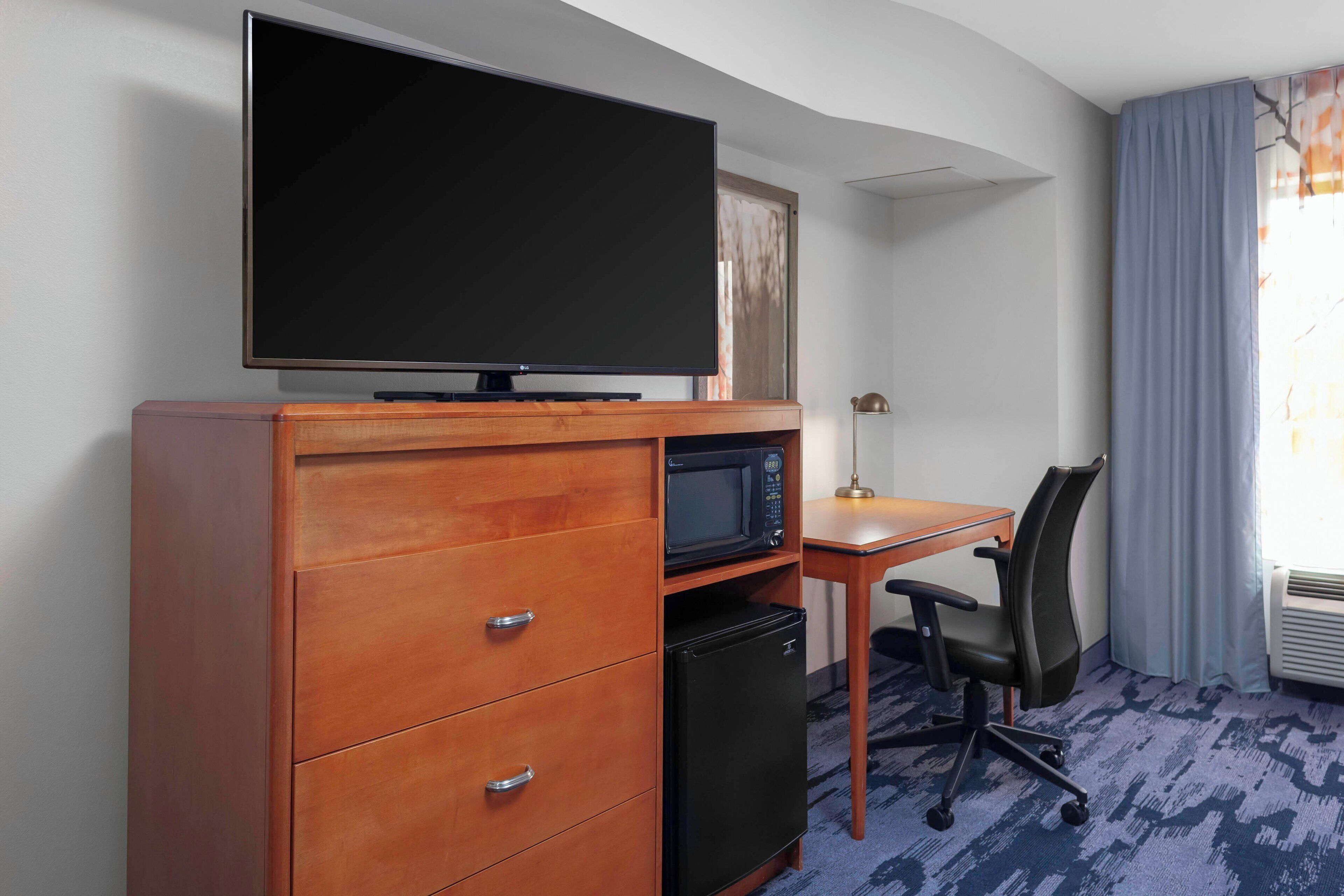 desk, laptop workspace, blackout curtains, iron/ironing board