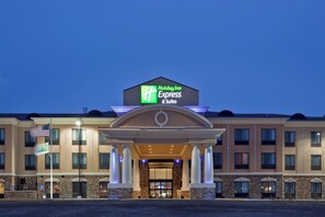 A Holiday Inn Express & Suites hotel with a prominent sign, a covered entrance, and a symmetrical facade. - Holiday Inn Express Hotel & Suites Hays by IHG (Hays)