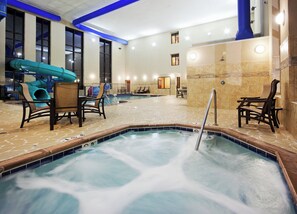 A hotel lobby with a hot tub, seating area, and a children's play area. - Holiday Inn Express Hotel & Suites Great Falls by IHG (Great Falls)