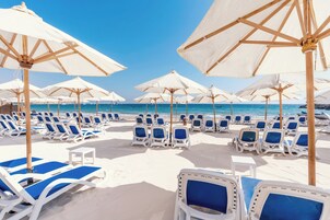 Playa privada, toallas de playa