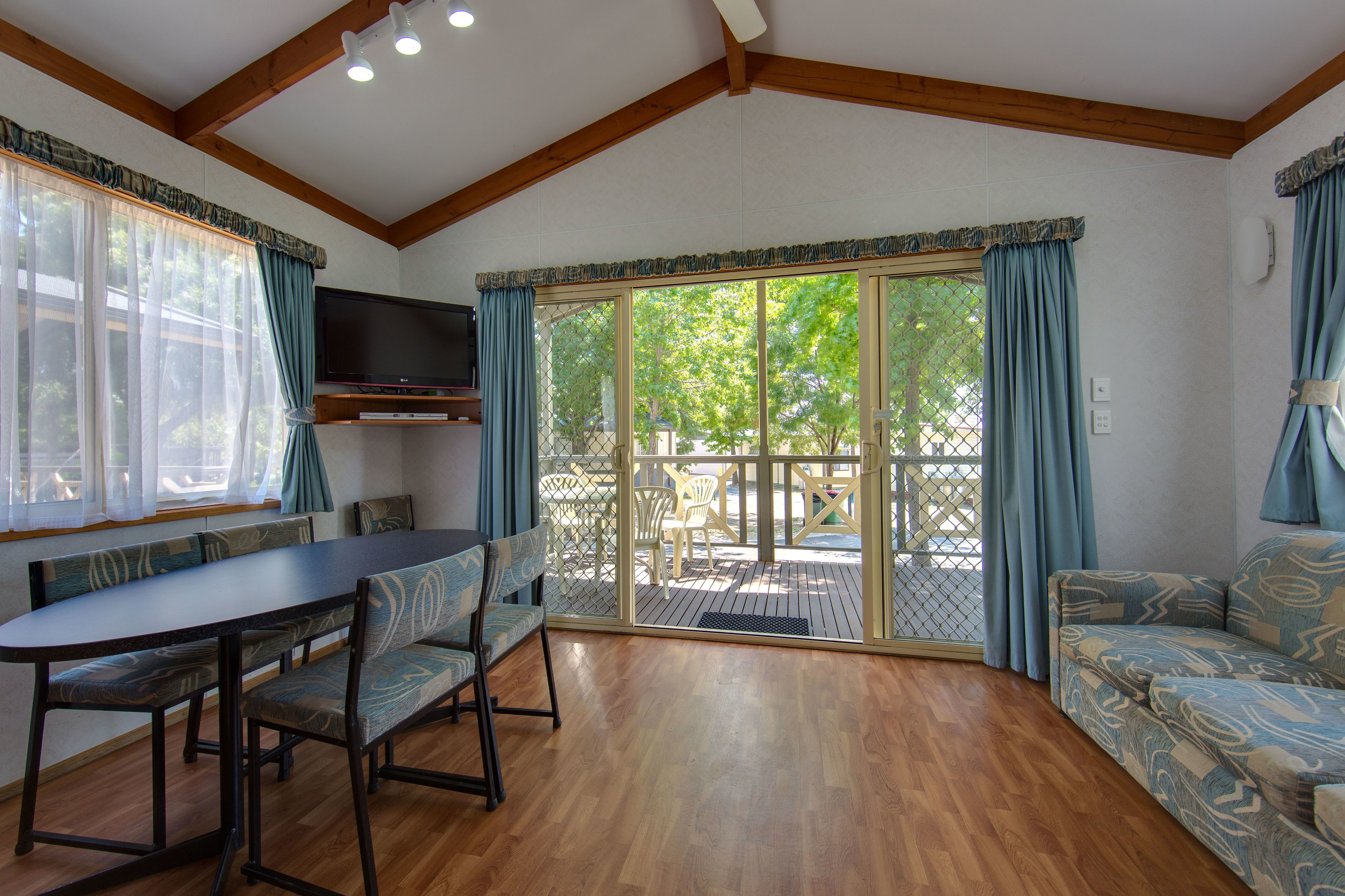Superior 2 Bedroom Cabin - Sleeps 6 | Living area | Flat-screen TV