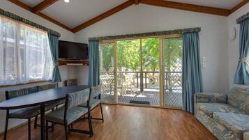 Superior 2 Bedroom Cabin - Sleeps 6 | Living area | Flat-screen TV